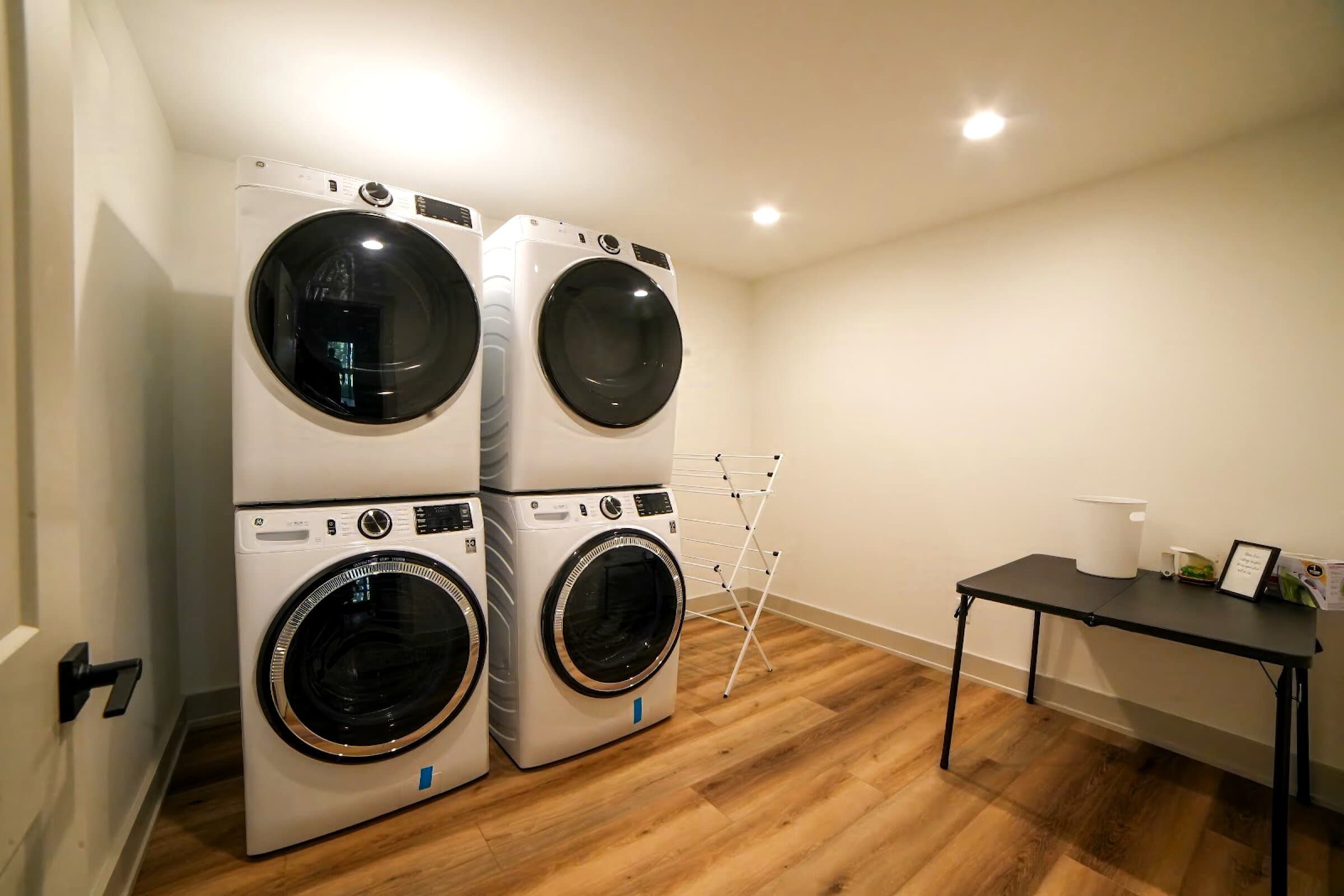 Two stacked washer-and-dryer sets for big groups